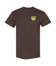 Load image into Gallery viewer, Brown t-shirt with a logo on the chest against a white background
