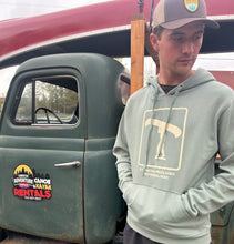 Load image into Gallery viewer, Man standing next to an old green truck Wearing a Kawartha Highlands Park Hoodie
