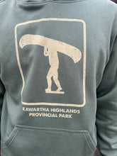 Load image into Gallery viewer, Green hoodie with Kawartha Highlands Provincial Park graphic on a person wearing it

